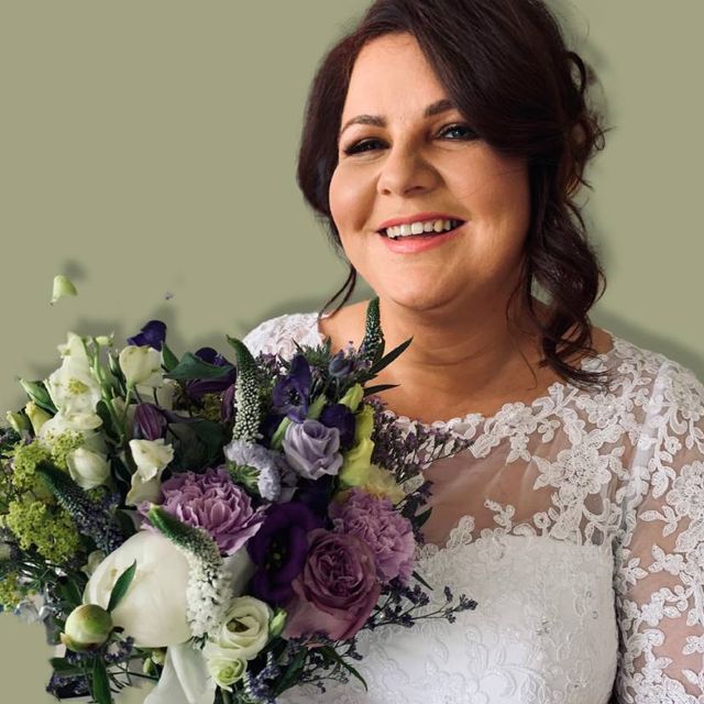 Bride with new hair do holding flowers